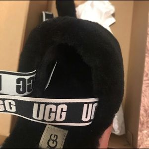 black fluffy slip on uggs